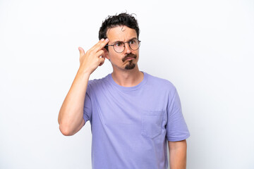 Fototapeta premium Young man with moustache isolated on white background with problems making suicide gesture