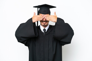 Young university graduate man isolated on white background covering eyes by hands