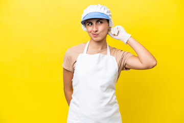 Fishwife woman over isolated background having doubts