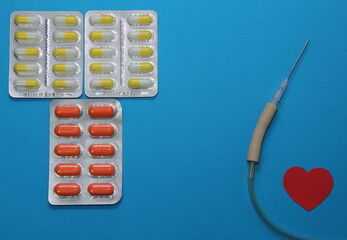 treatment of cardiac diseases, tablets in a blister on a blue background