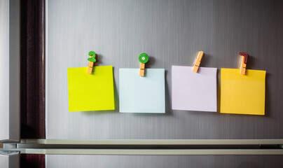 Abstract of wooden heart clip with Blank paper and stick paper on refrigerator door. paper note...