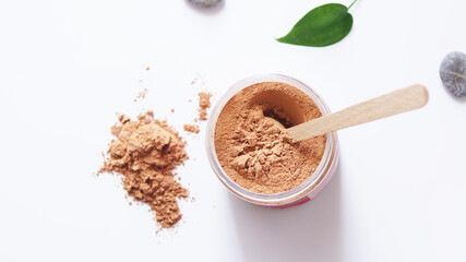 Red cosmetic clay for the face. Natural face mask.