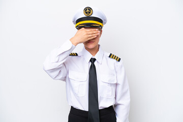 Airplane caucasian pilot woman isolated on white background covering eyes by hands. Do not want to see something
