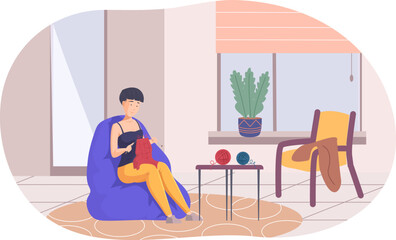 Young woman sitting in cozy armchair and knitting. Woman knitting with needles and woolen thread sitting in cosy living room. Needlework, handcraft, creative hobby or recreation