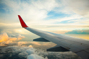 Fototapeta premium Morning sunrise with Wing of an airplane. Photo applied to tourism operators. picture for add text message or frame website. Traveling concept