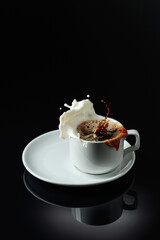 Coffee with milk splashes.