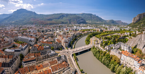 The drone aerial view of the Isère river and Grenoble city, France. Grenoble is the prefecture and largest city of the Isère department in the Auvergne-Rhône-Alpes region.