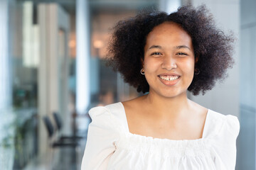 Happy smiling carefree young African woman