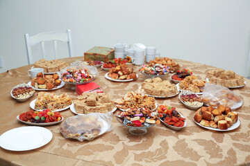 A variety of oriental sweets on the table in the cafe, treats for dear guests.