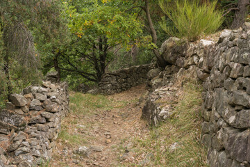 Cultural landscape in the Ardeche France at the village of Creysseilles near 07000 Privas stony path with dry masonry