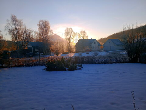 sunrise over the house in winter