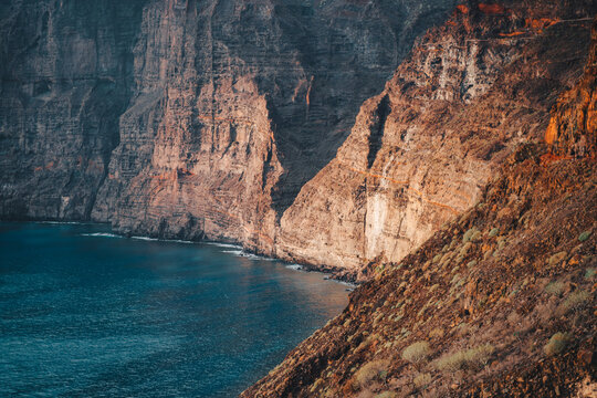 Los Gigantes cliffs, mountain ranges and deep ocean view at sunset. Tenerife. Santiago del Teide. Canary Islands, Spain. Close up. Detailed high quality image.