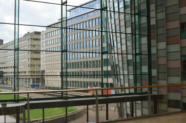 Beautiful city street with buildings, view through big glass windows