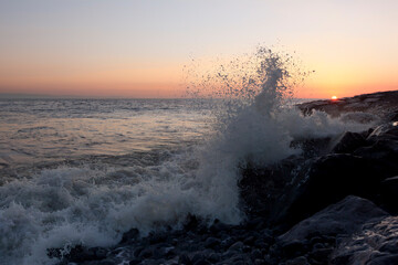 Breaking waves at sunset