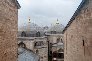 Fototapeta na wymiar Domes of the Hagia Sophia mosque with the Blue Mosque in the background