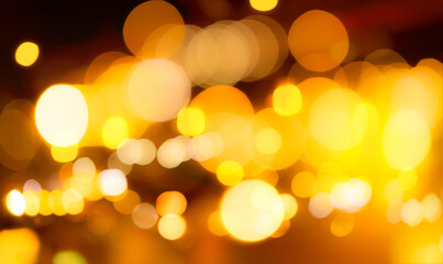 Blur gold color bokeh background. Blur abstract background of city light. Warm light with beautiful...