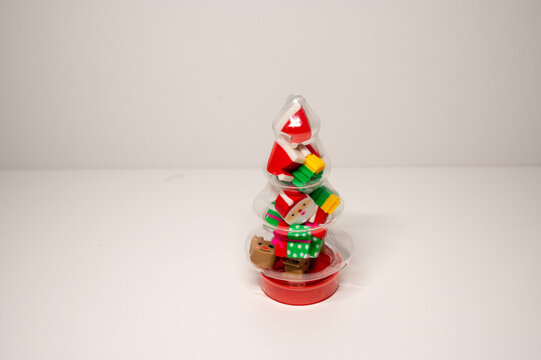 Christmas tree style toy, filled with holiday shaped erasers