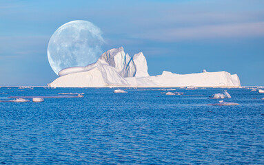 Giant iceberg near Kulusuk with full moon - Greenland, East Greenland 