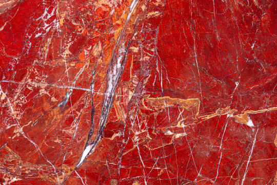 Red Jasper. Gemstone background. Matt natural semi precious mineral pattern. Semiprecious stone texture for ceramic wall and floor digital tiles. Material for interior, exterior design decoration.