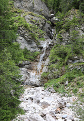 mountain stream with pure water produced by the melting of high altitude glaciers