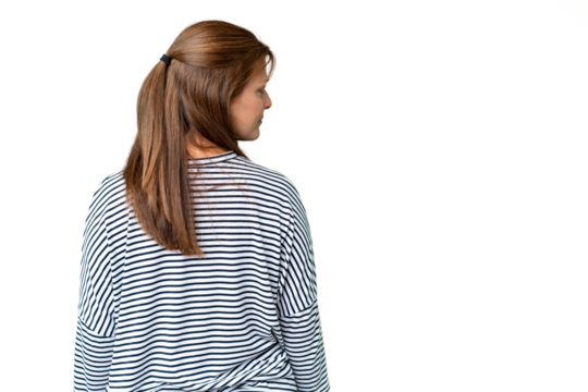 Middle age woman over isolated background in back position and looking side