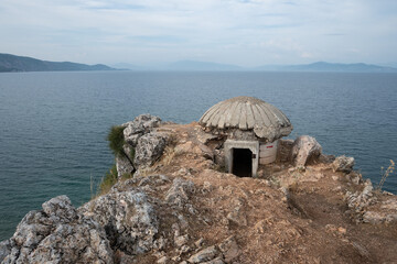 Bunker on the Lin peninsula with North Macedonia in the background, Korçë County, Albania