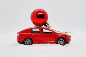 Red car with a Christmas ball on top