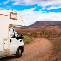 Family vacation travel- holiday trip on motorhome in desertic landscape