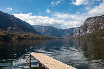 Scenic view of a small wooden jetty at lake Bohinj in the Triglav National Park, The Julian Alps of Slovenia