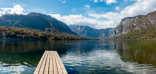 Scenic view of a small wooden jetty at lake Bohinj in the Triglav National Park, The Julian Alps of...