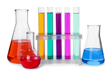 Test tubes and other laboratory glassware with colorful liquids on white background