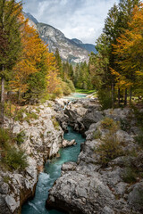 The Soca river flowing through a wild mountain landscape of the Julian Alps in Slovenia
