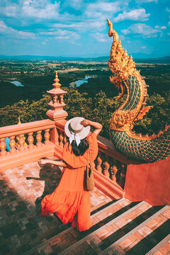 Traveler asian woman with dress travel in temple at Lampang Thailand