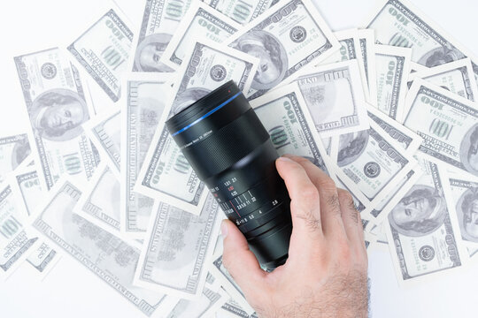 Buying a camera lens for money