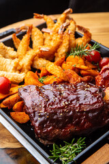 Shrimp platter in batter, fish and chips, rustic potatoes, ribs and wings in BBQ sauce