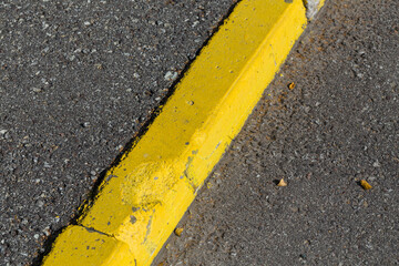 Fototapeta premium Yellow curb stone border