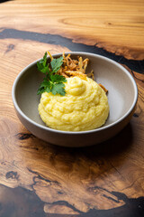 Garnish mashed potatoes with herbs