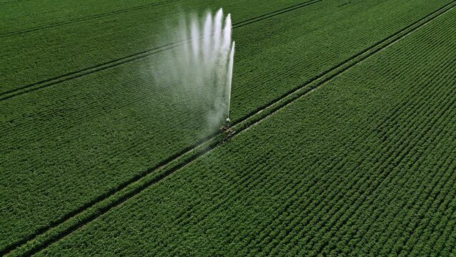 Aerial view of the irrigation of the beautiful green farmland