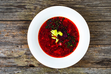Borsch - beetroots soup on wooden table
