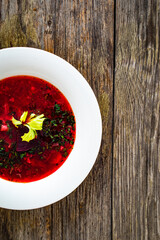 Borsch - beetroots soup on wooden table

