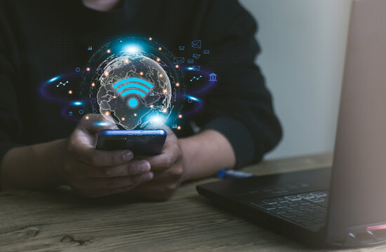 Business using smartphone ,with wifi icon,business communication social network concept. - Powered by Adobe