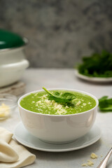 Spinach soup. Green creamy, vegan creamy soup on bright background