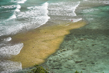 The water reduces the waves, the beach, the coral