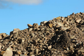 Pile with gravel och rocks at a construction site