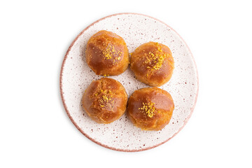 Traditional turkish dessert sekerpare with almonds and honey isolated on white, top view.