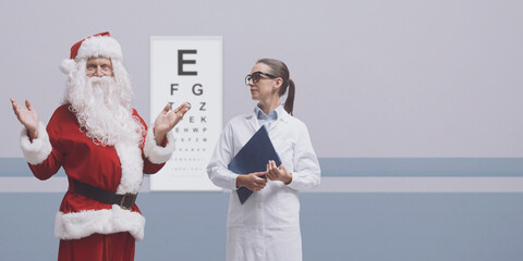 Cheerful Santa having a vision test