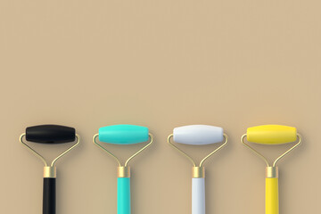 Row of different colors face massage rollers. Lifting face and wellness. Cosmetics accessories. Facial skincare. Copy space. Top view. 3d render