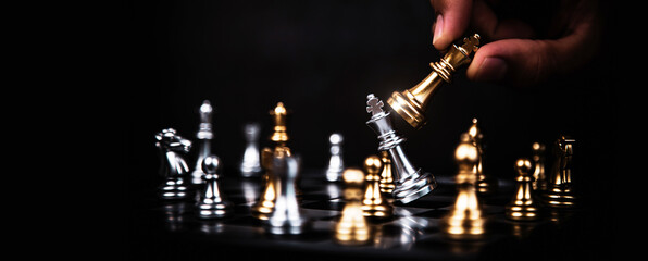 Hand choose king chess fight concept of challenge or team player or business team and leadership...