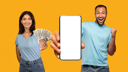 Overjoyed arab couple holding a lot of cash and smartphone