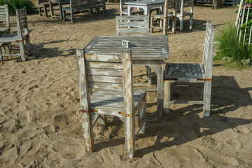Fototapeta na wymiar Sanur, Denpasar (12 November 2022): Cafe tables and chairs are lined up on the beach